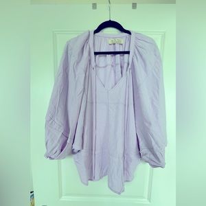 Flowy, lightweight, linen top. Batwing details, length to waist